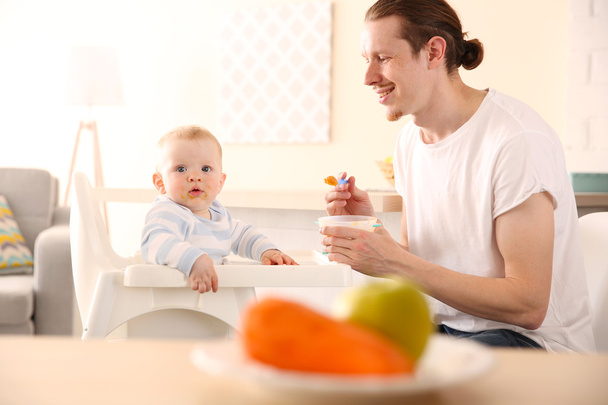 Healthy food feeding concept. Carrot and apple on kitchen table - Fotó, kép