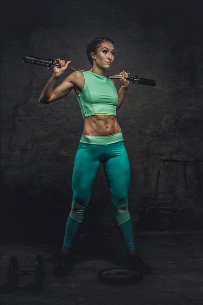 sporty female in azure sportswear - Photo, Image