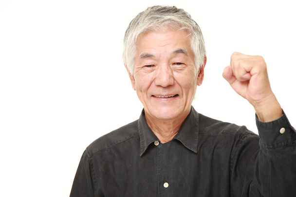 senior Japanese man in a victory pose - Фото, изображение