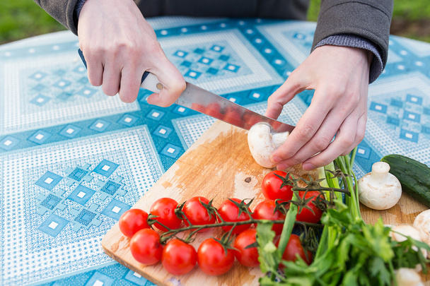 hands chopping fresh vegetables - Fotó, kép