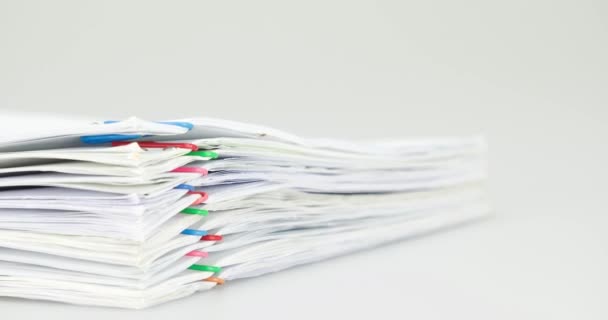 Pile overload paperwork on white background time lapse - Imágenes, Vídeo