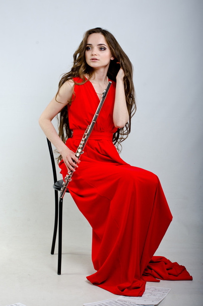 Chica con flauta
 - Foto, imagen