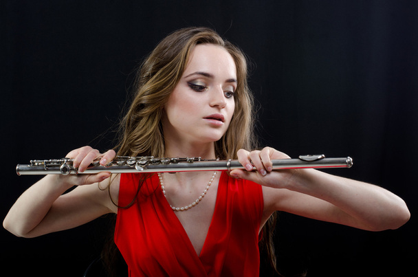 Chica con flauta
 - Foto, imagen