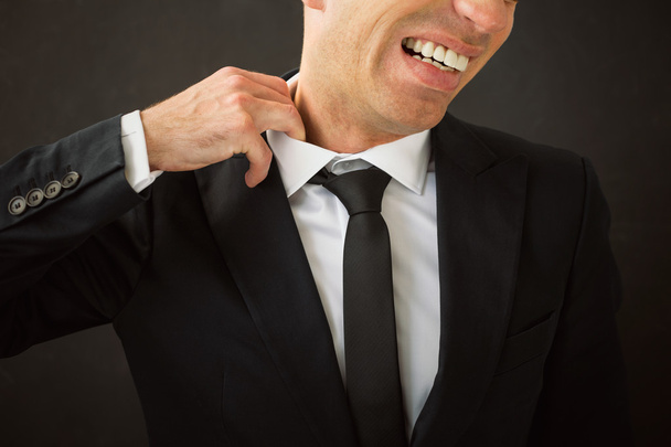 Business man pulling his shirt of his neck - Photo, Image