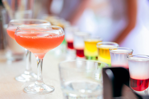 Colorful cocktails in a bar counter - Fotoğraf, Görsel
