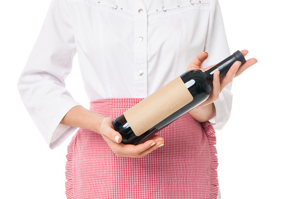Close-up of womans hand holding bottle with wine - Φωτογραφία, εικόνα