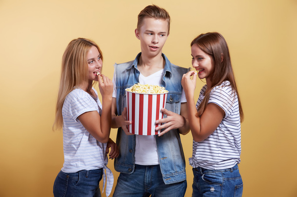 Boy and two girls with popcorn - Фото, зображення