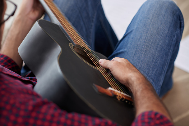 Musician enjoying playing his guitar - Φωτογραφία, εικόνα