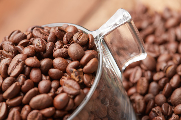 Fresh roasted coffee beans in cup  - Valokuva, kuva
