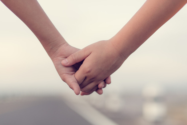 Hands holding together, boy and girl holding hands. - Fotografie, Obrázek