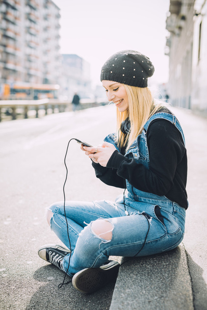 blonde woman using smart phone - Photo, Image