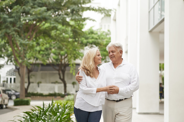 Mature couple walking in the street - Photo, Image