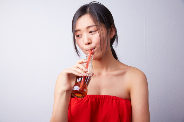 Chinese woman drinking carbonated drink - Φωτογραφία, εικόνα