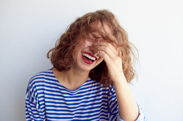 Laughing woman with curly hair  - Foto, Bild