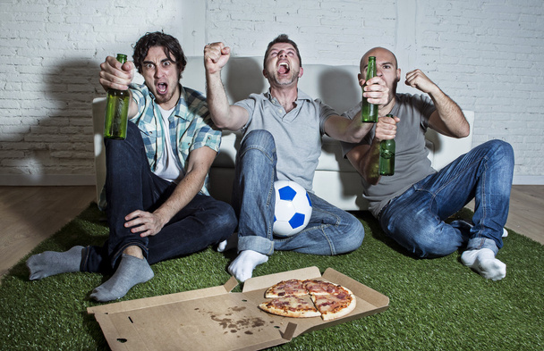 fanatic fans friends watching football on tv celebrating goal sc - Photo, Image