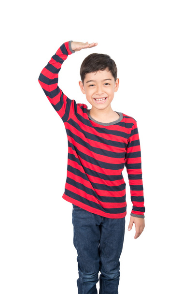 Little boy checking his height on white background - Photo, Image
