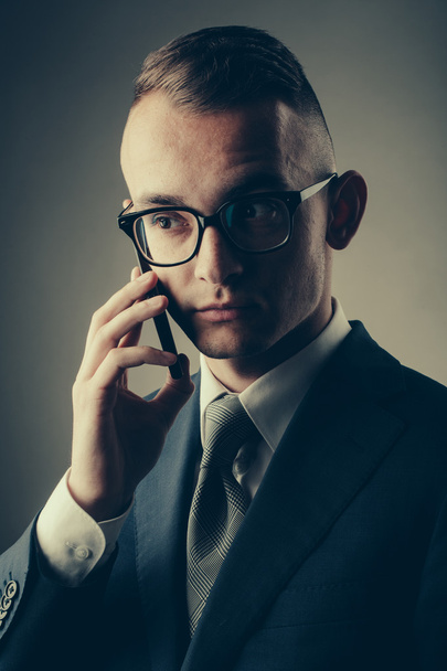 Guy in glasses with mobile phone - Foto, immagini