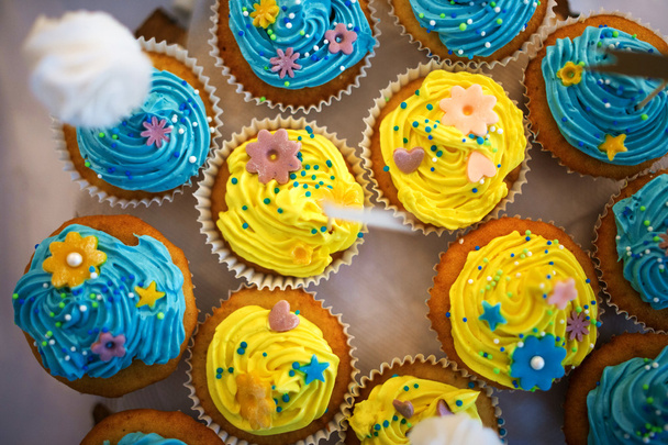 Multiple pastel colored cupcakes - Photo, Image