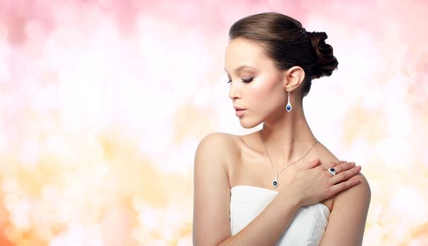 beautiful woman with earring, ring and pendant - Photo, Image