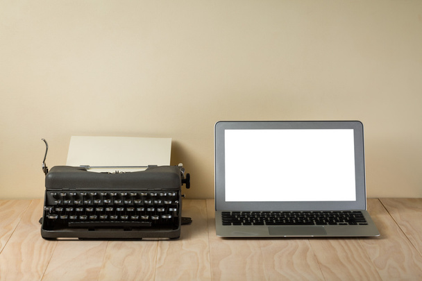 Image of vintage typewriter and modern laptop - Fotó, kép