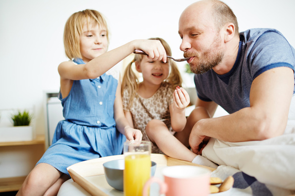 father and daughters with breakfast - Photo, Image