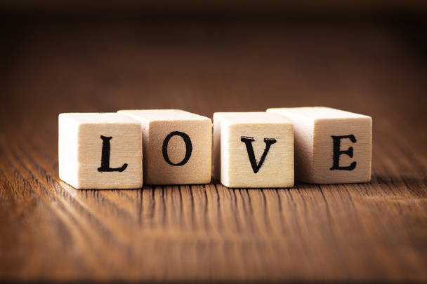 Love message. Love message written in wooden blocks. - 写真・画像