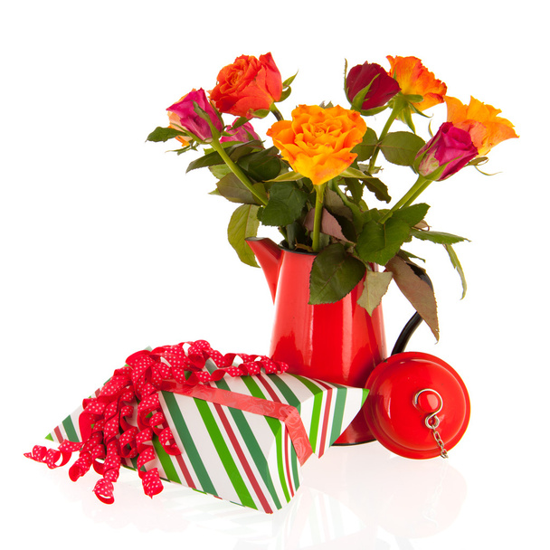 Bouquet roses in vase with gifts - 写真・画像