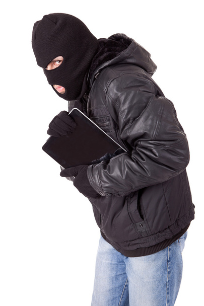 Thief holding a laptop - Фото, изображение