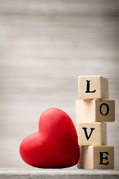 Love message. Love message written in wooden blocks. - Foto, afbeelding