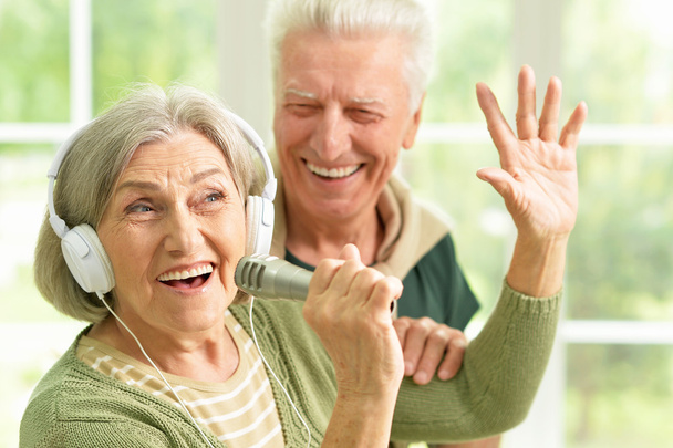 Senior couple with headphones  - Photo, Image