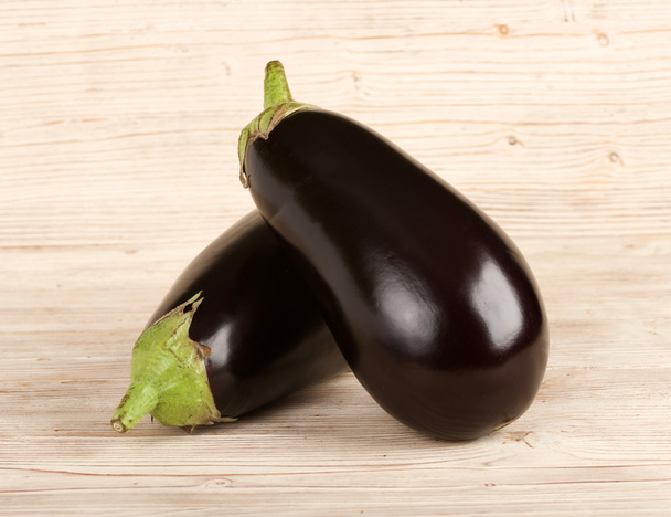 aubergine on a wooden background - Photo, Image