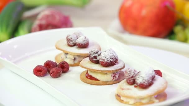 Freshly baked cookies with cream and raspberries - Footage, Video