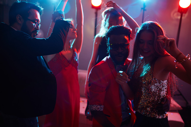  friends with champagne dancing - 写真・画像