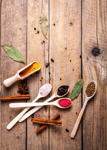 Spices on wooden background. With empty space for advertising te - Foto, Bild