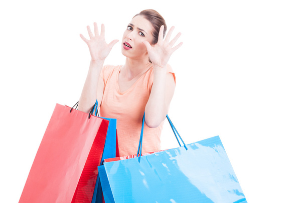 Woman carrying shopping feeling scared or afraid - 写真・画像