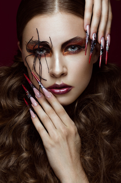 woman in the image of spider with creative art makeup and long nails. Manicure design, beauty face. - Fotografie, Obrázek