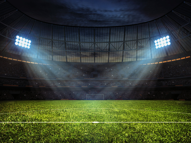 Γήπεδο ποδοσφαίρου ποδοσφαίρου με νυχτερινό φωτισμό - Φωτογραφία, εικόνα