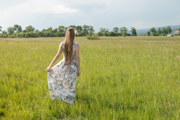 Portrait of beautiful blond woman in a field - Fotografie, Obrázek