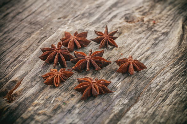 Heap of Star Anise, on wooden surface. - Photo, Image