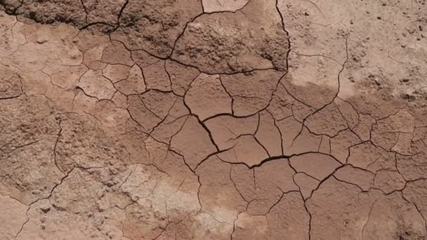 camera pan view over cracked dirt. quarry background. - Footage, Video