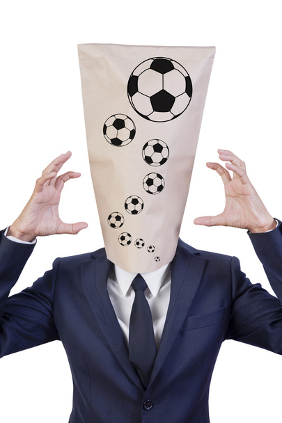 Uomo d'affari coprire testa di calcio pazzo
 - Foto, immagini