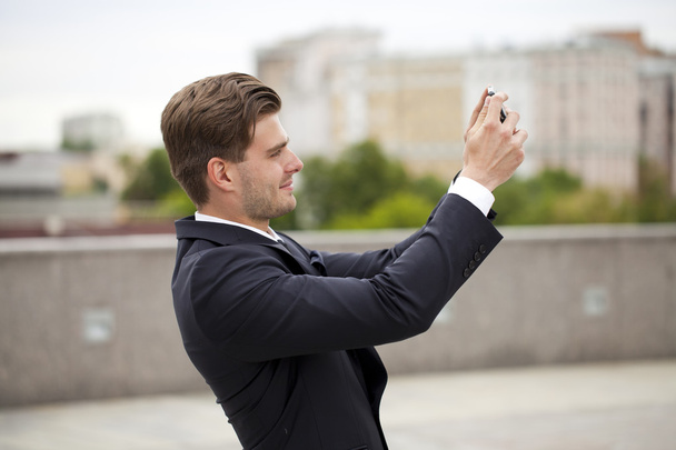 Businessman using mobile phone  - Фото, зображення