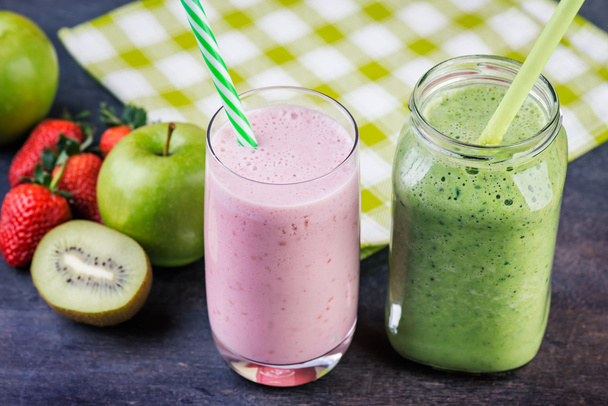 Healthy smoothies in glasses with ingredients on dark background - Foto, imagen