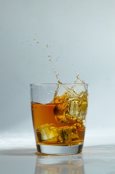 whiskey with ice in glass - 写真・画像