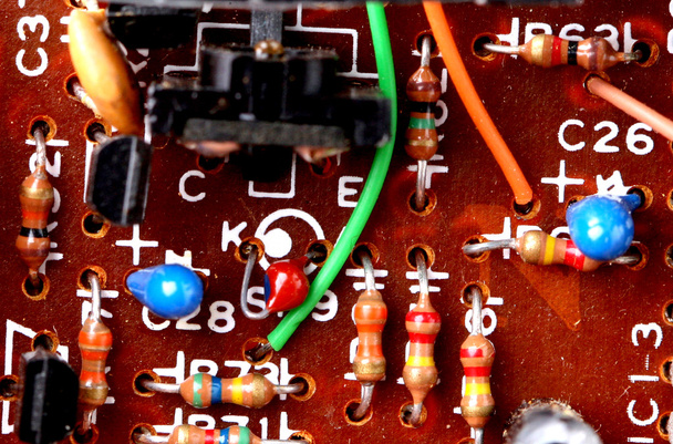 Part of old vintage printed circuit board with electronic components. - Photo, Image