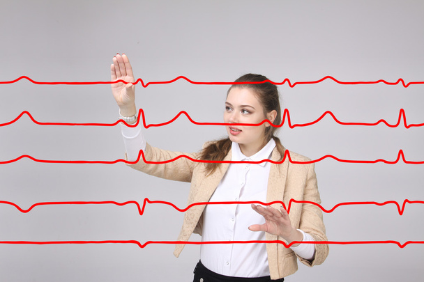 Doctor woman working with cardiogram lines - Photo, image