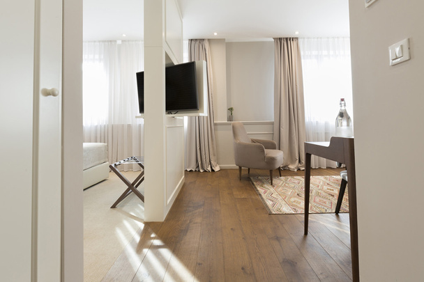 Hotel apartment interior with rotating mirror tv - 写真・画像