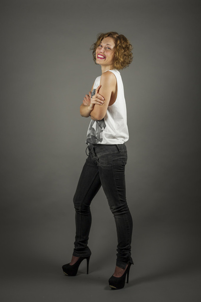 Full shot portrait of beautiful woman brunette with curly hair - Foto, Bild