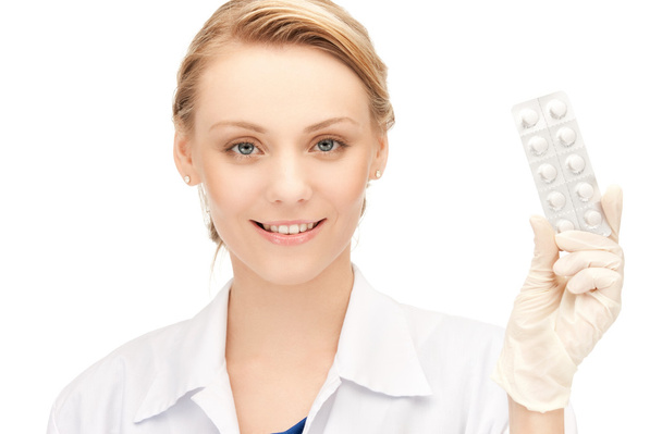 Attractive female doctor with pills - Photo, image