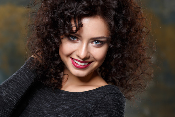 Close-up portrait of beautiful young woman with gorgeous hair style and makeup. Fashion beauty photo - Фото, зображення